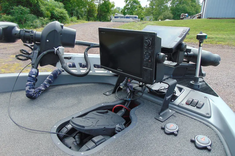 Slide: The Image of Control panel of a 2010 Boomeranger 188 boat with navigation equipment. - 7