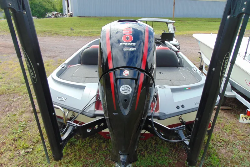 Slide: The Image of Boomeranger 188 boat, 2010 model, featuring a powerful outboard motor and spacious deck. - 4