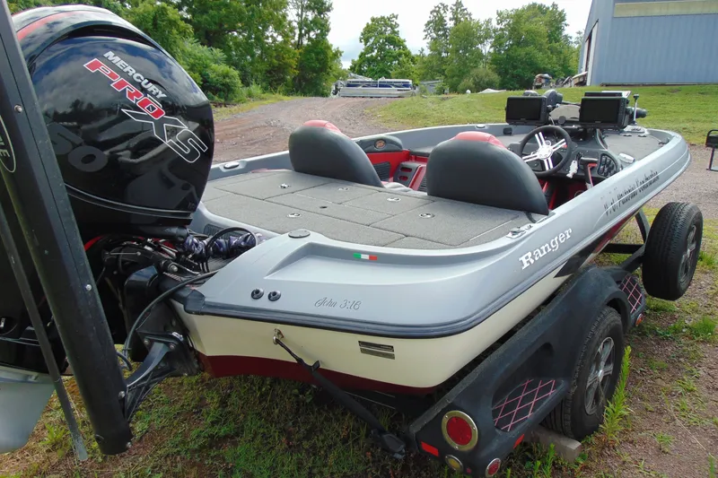 Slide: The Image of Boomeranger 188 boat, 2010 model, with Mercury Pro XS engine on a trailer. - 5