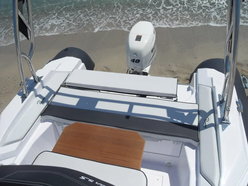 Slide: The Image of 2025 Ranieri CAYMAN 19 Sport boat on sandy beach with outboard motor. - 7