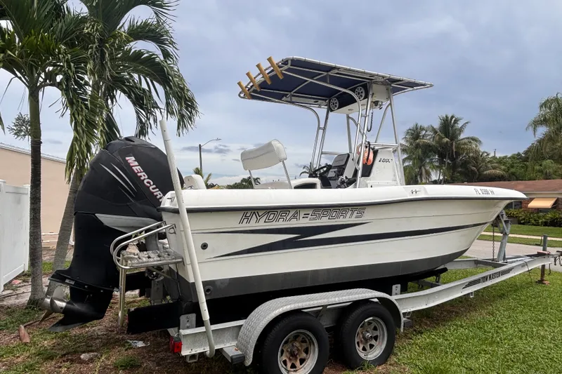 Slide: The Image of 1992 Hydra-Sports 2000 CC boat on trailer, parked near palm trees. - 3