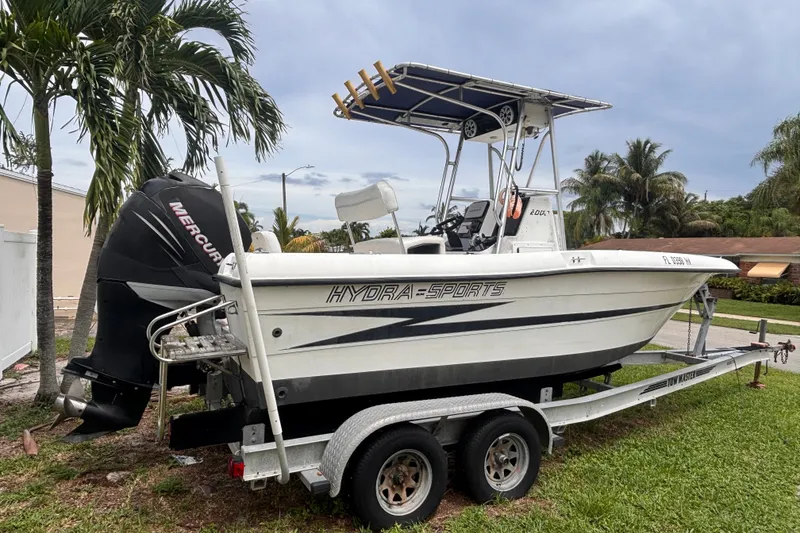 Slide: The Image of 1992 Hydra-Sports 2000 CC boat on trailer, parked near palm trees. - 4