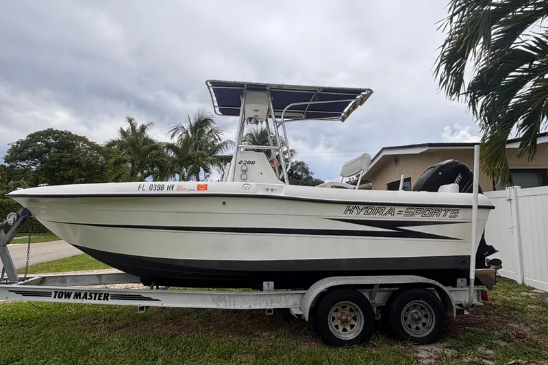 Slide: The Image of 1992 Hydra-Sports 2000 CC boat on trailer, parked outdoors with palm trees. - 10
