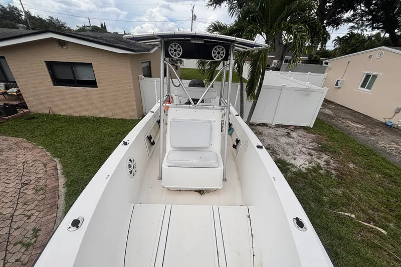 Slide: The Image of 1992 Hydra-Sports 2000 CC boat parked in a residential backyard. - 30