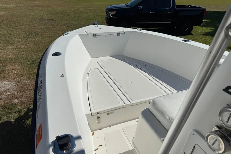 Slide: The Image of 1992 Hydra-Sports 2000 CC boat interior with seating and storage, parked on grass. - 5