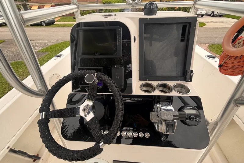 Slide: The Image of 1992 Hydra-Sports 2000 CC boat console with steering wheel, Garmin display, and controls. - 21