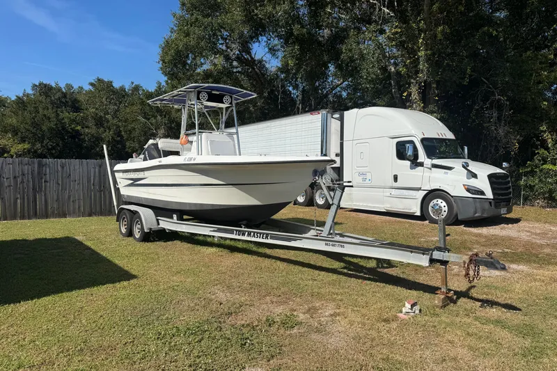 Slide: The Image of 1992 Hydra-Sports 2000 CC boat on trailer, parked beside a white truck. - 2