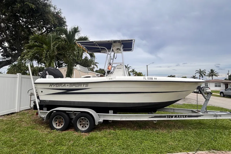 Slide: The Image of 1992 Hydra-Sports 2000 CC boat on trailer, parked in a residential area. - 1