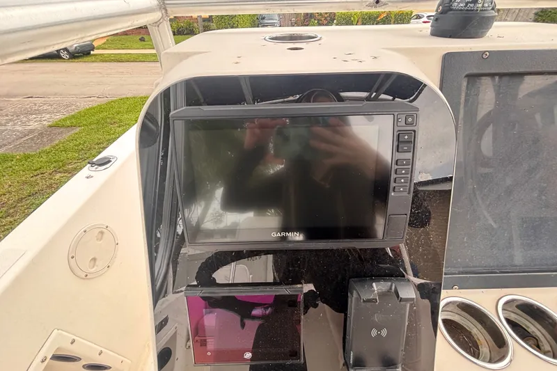 Slide: The Image of 1992 Hydra-Sports 2000 CC boat dashboard with Garmin navigation system. - 23