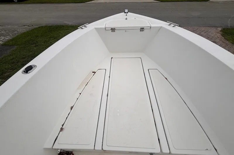 Slide: The Image of 1992 Hydra-Sports 2000 CC boat interior, featuring spacious white deck and storage compartments. - 29