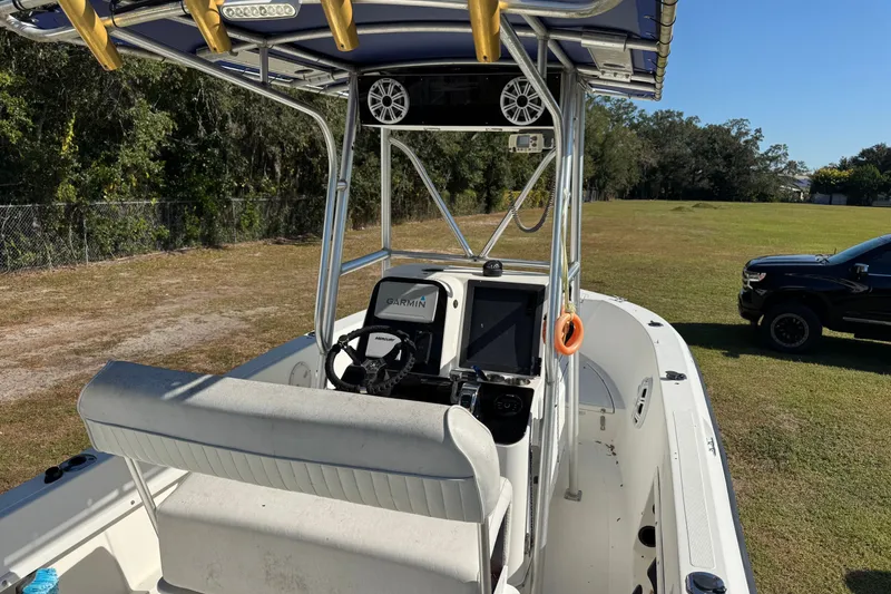 Slide: The Image of 1992 Hydra-Sports 2000 CC boat with Garmin navigation, parked on grass near a black truck. - 3
