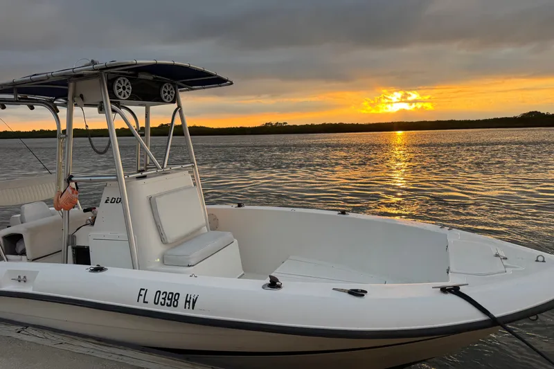 The Image of 1992 Hydra-Sports 2000 CC boat docked at sunset on a tranquil waterway. - 0