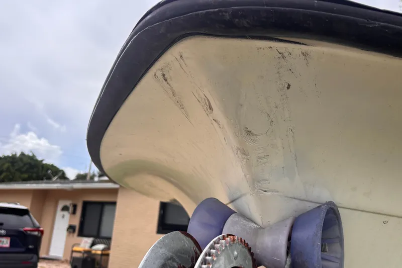 Slide: The Image of Close-up of 1992 Hydra-Sports 2000 CC boat hull with visible wear and roller. - 15