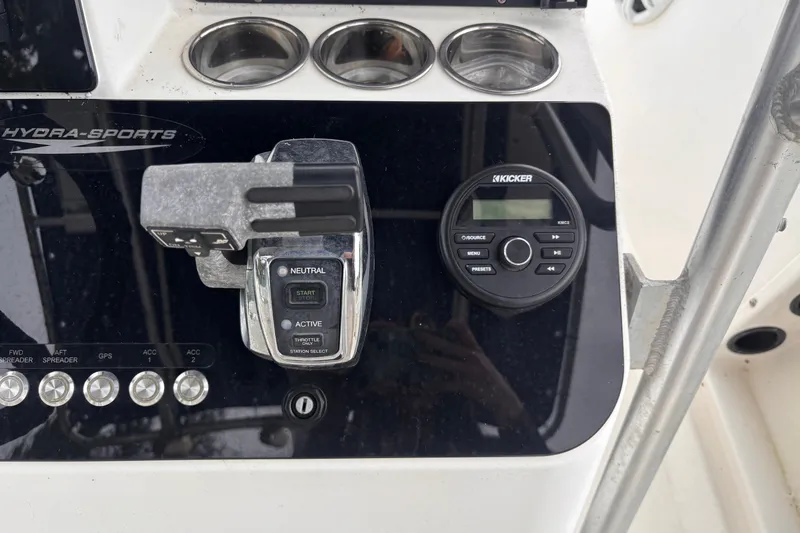 Slide: The Image of Control panel of a 1992 Hydra-Sports 2000 CC boat with switches and audio controls. - 27