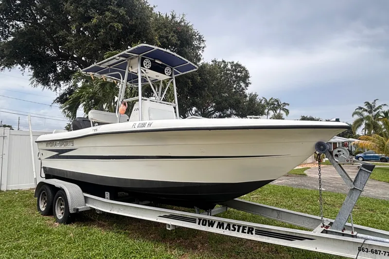Slide: The Image of 1992 Hydra-Sports 2000 CC boat on Tow Master trailer, parked on grass. - 2