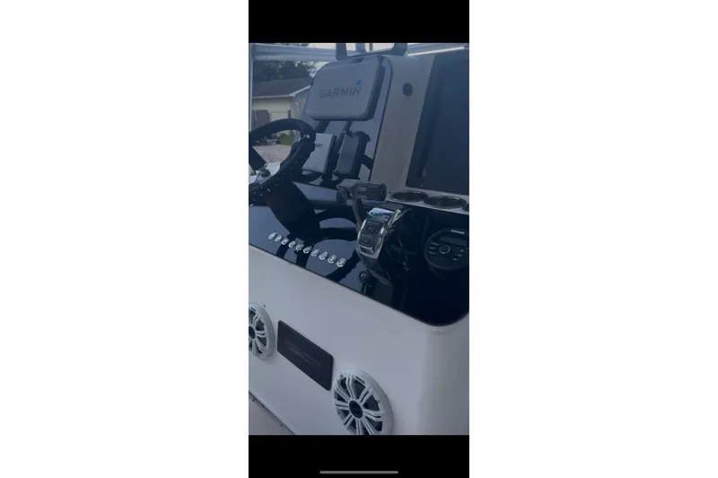 Slide: The Image of 1992 Hydra-Sports 2000 CC boat dashboard with Garmin navigation system and controls. - 7