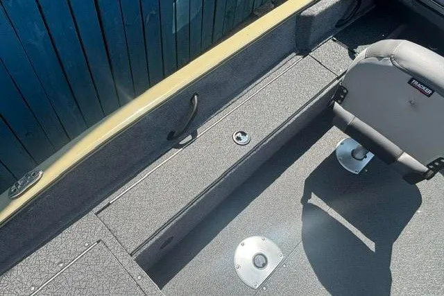Slide: The Image of 2027 Tracker Pro Guide V-16 WT boat interior with seating and storage compartments. - 15