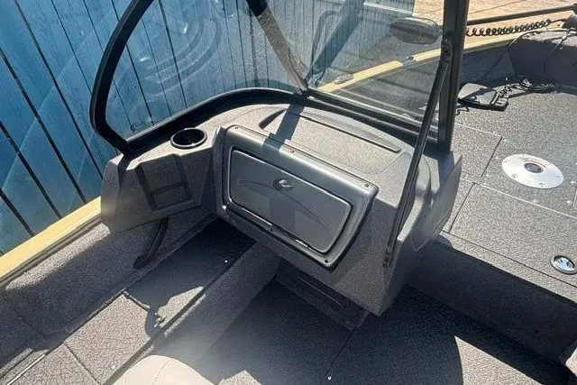 Slide: The Image of 2027 Tracker Pro Guide V-16 WT boat interior with windshield and storage compartment. - 11