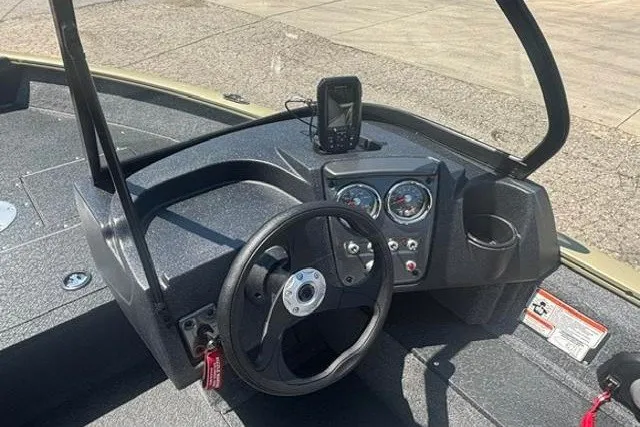 Slide: The Image of Steering console of 2027 Tracker Pro Guide V-16 WT boat with gauges and GPS device. - 9