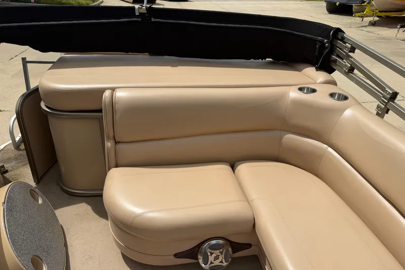 Slide: The Image of Luxurious seating on a 2008 Godfrey San Pan 2500 pontoon boat with cup holders. - 15