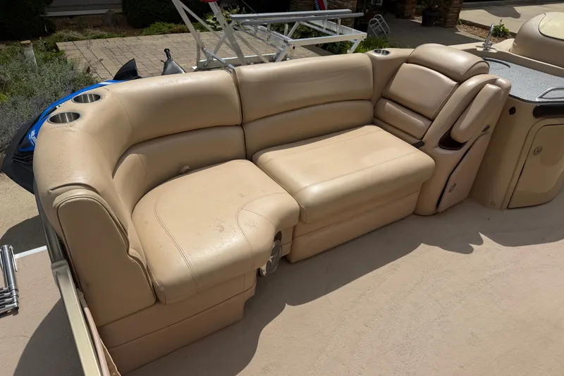 Slide: The Image of Luxurious beige seating on a 2008 Godfrey San Pan 2500 pontoon boat. - 4