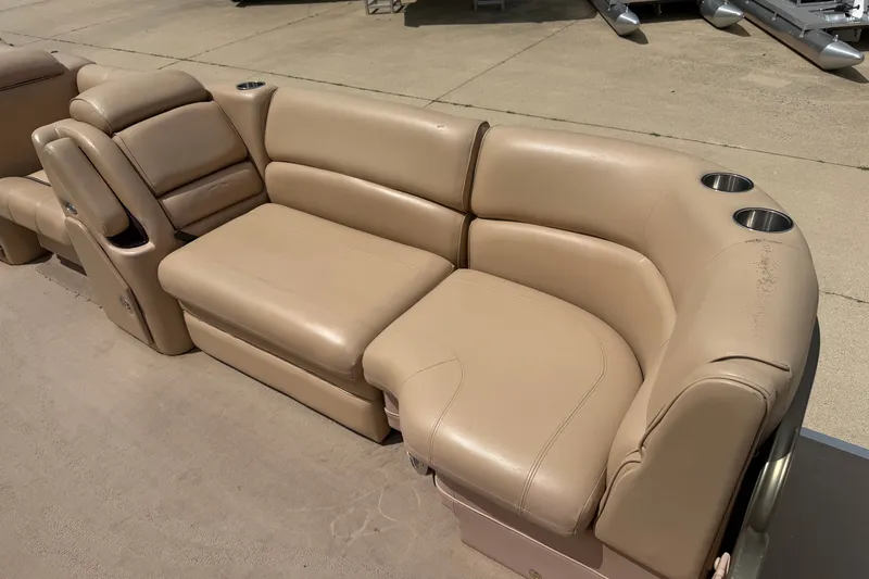 Slide: The Image of Beige leather seating on a 2008 Godfrey San Pan 2500 pontoon boat with cup holders. - 3