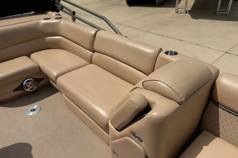 Slide: The Image of Beige leather seating on 2008 Godfrey San Pan 2500 pontoon boat, featuring cup holders. - 8
