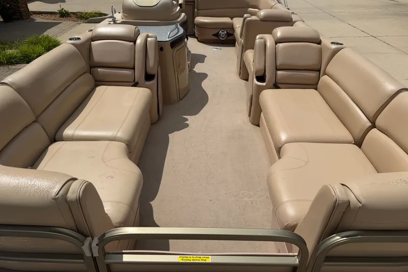 Slide: The Image of 2008 Godfrey San Pan 2500 pontoon boat with spacious beige seating and sleek design. - 2