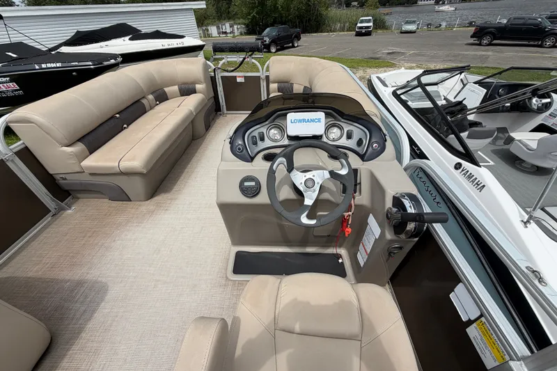 Slide: The Image of 2020 Sun Tracker Party Barge 22 DLX interior with steering console and seating. - 8