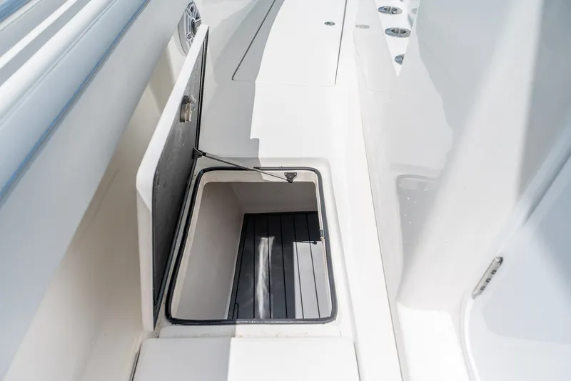 Slide: The Image of Open storage compartment on 2021 SeaHunter 41 CTS boat deck. - 49