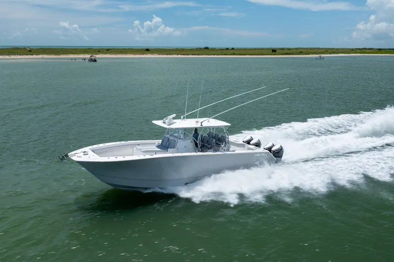 Slide: The Image of 2021 SeaHunter 41 CTS boat cruising on open water, showcasing speed and performance. - 21