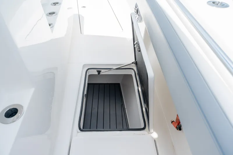 Slide: The Image of Open storage compartment on 2021 SeaHunter 41 CTS boat deck. - 50