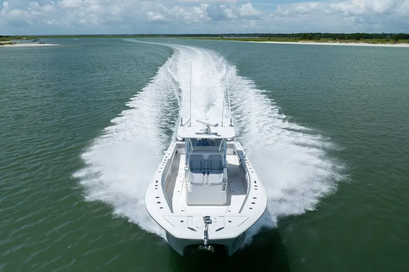 Slide: The Image of 2021 SeaHunter 41 CTS boat cruising on open water, leaving a wake behind. - 20