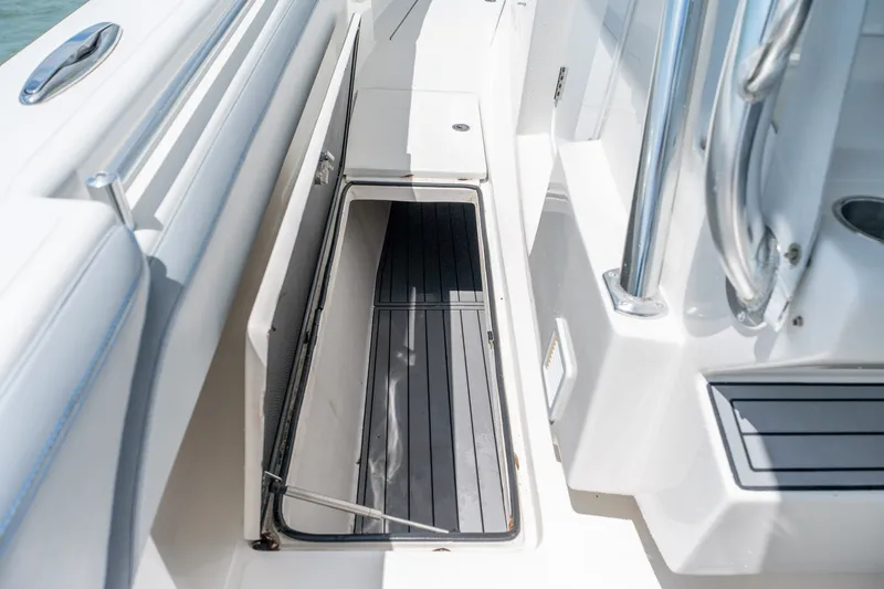 Slide: The Image of Open storage compartment on 2021 SeaHunter 41 CTS boat deck. - 48
