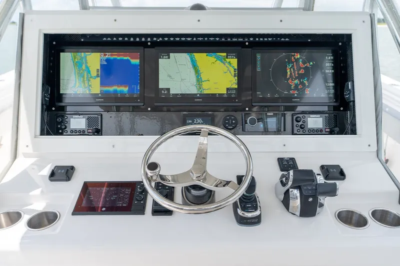 Slide: The Image of Helm of 2021 SeaHunter 41 CTS with advanced navigation displays and controls. - 37