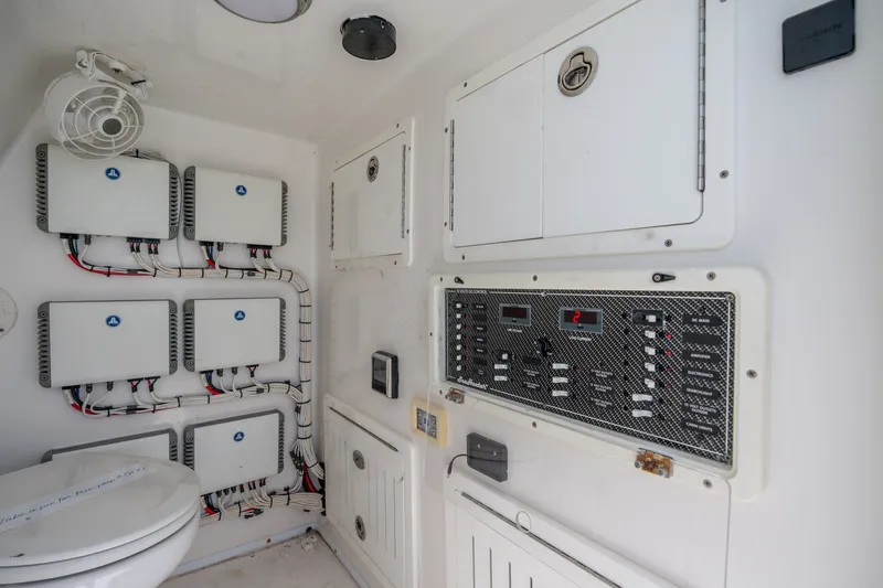 Slide: The Image of Electrical control panel and wiring inside a 2021 SeaHunter 41 CTS boat. - 13