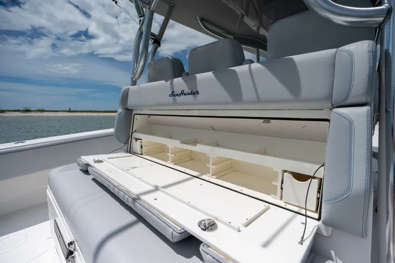 Slide: The Image of 2021 SeaHunter 41 CTS boat interior with open storage compartment, showcasing sleek design. - 39