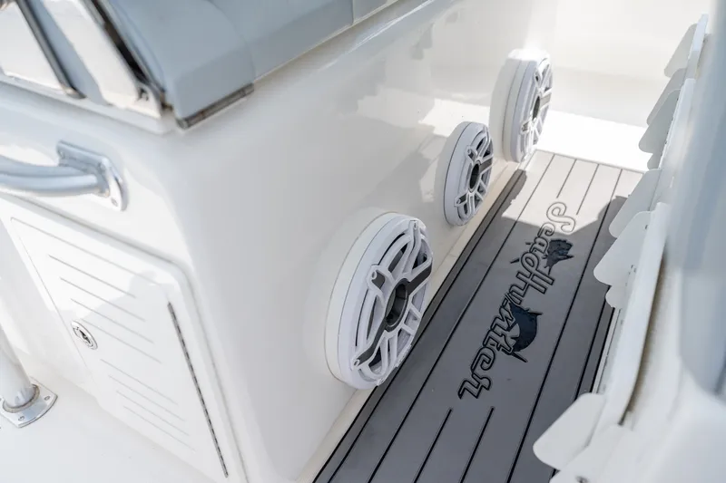 Slide: The Image of 2021 SeaHunter 41 CTS boat interior with speakers and branded flooring. - 52