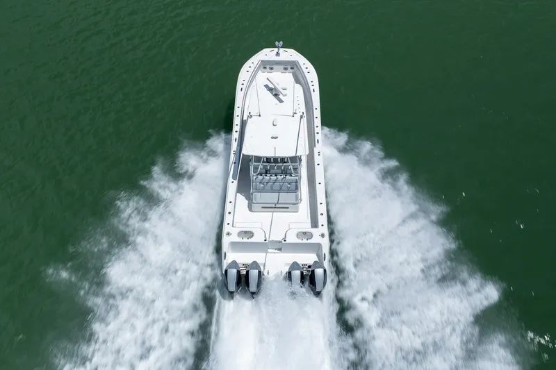 Slide: The Image of 2021 SeaHunter 41 CTS boat cruising on open water, aerial view. - 18
