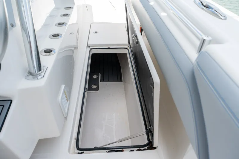 Slide: The Image of Open storage compartment on 2021 SeaHunter 41 CTS boat deck. - 51