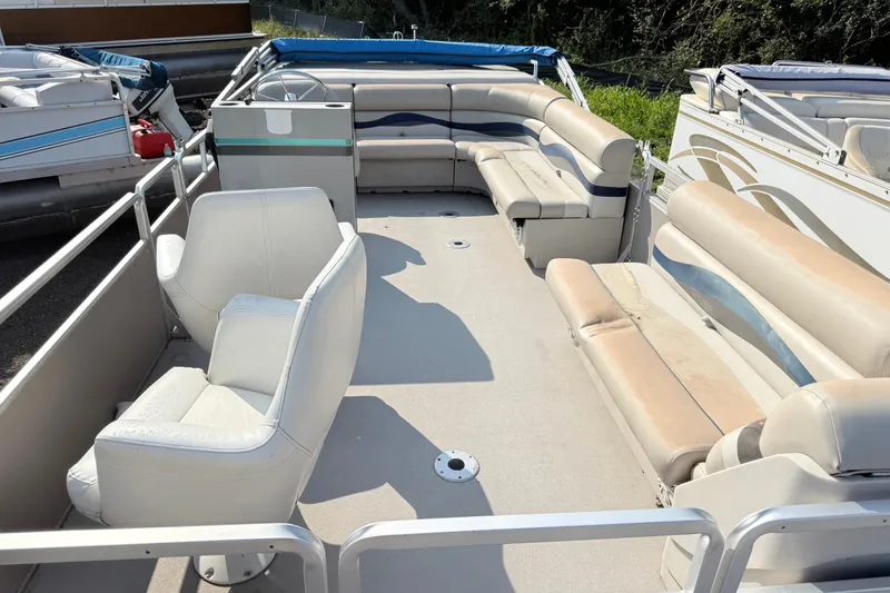 Slide: The Image of 1991 Harris FloteBote 240 pontoon boat interior with spacious seating and steering console. - 3
