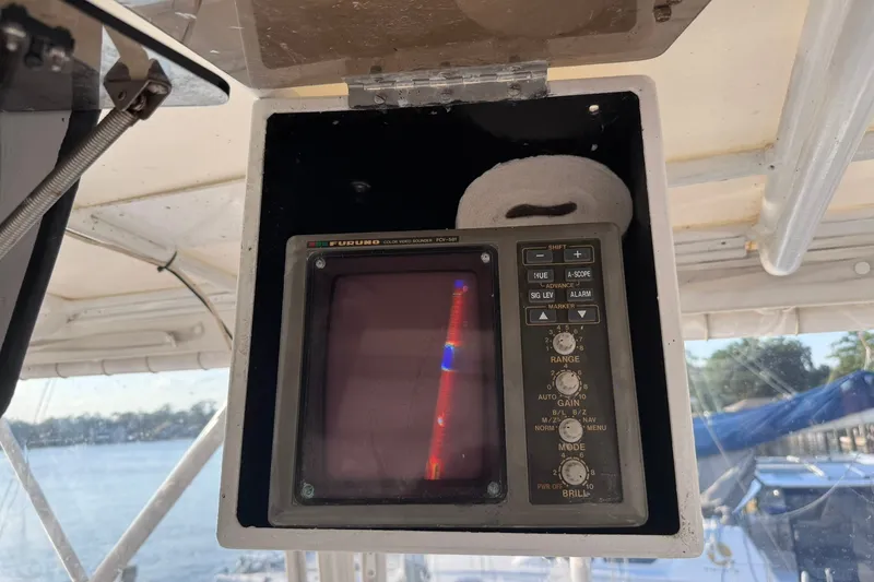 Slide: The Image of Furuno color video sounder on 1981 Hatteras 43 Convertible boat, docked by the water. - 52