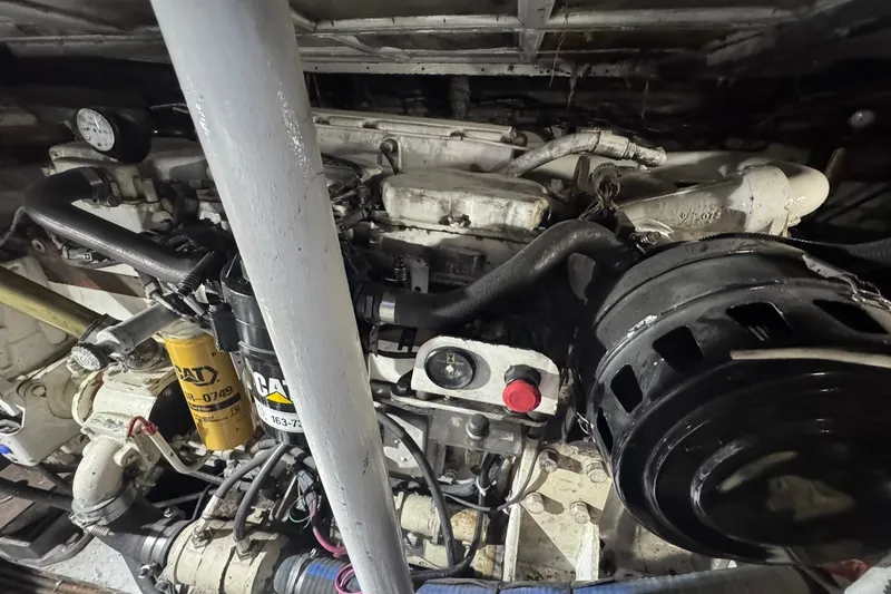 Slide: The Image of Engine room of a 1981 Hatteras 43 Convertible with visible CAT components. - 78