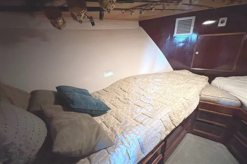 Slide: The Image of Cozy cabin interior of 1981 Hatteras 43 Convertible yacht with comfortable bedding. - 35