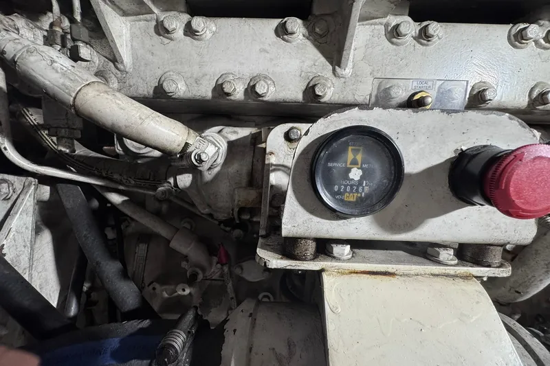 Slide: The Image of Engine compartment of a 1981 Hatteras 43 Convertible with service meter and red knob. - 76