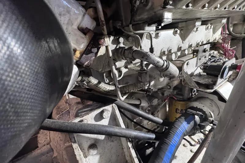 Slide: The Image of Engine compartment of a 1981 Hatteras 43 Convertible boat, showcasing mechanical components. - 75