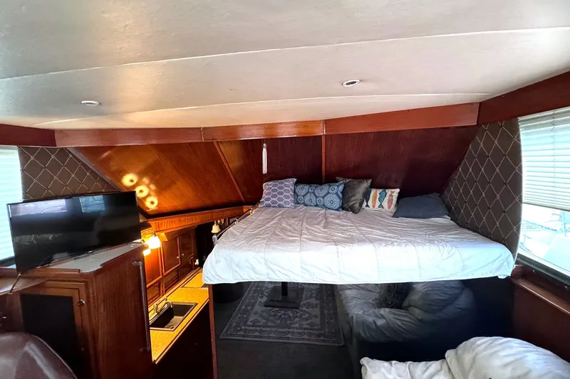 Slide: The Image of Interior of 1981 Hatteras 43 Convertible yacht with cozy bed and modern amenities. - 21