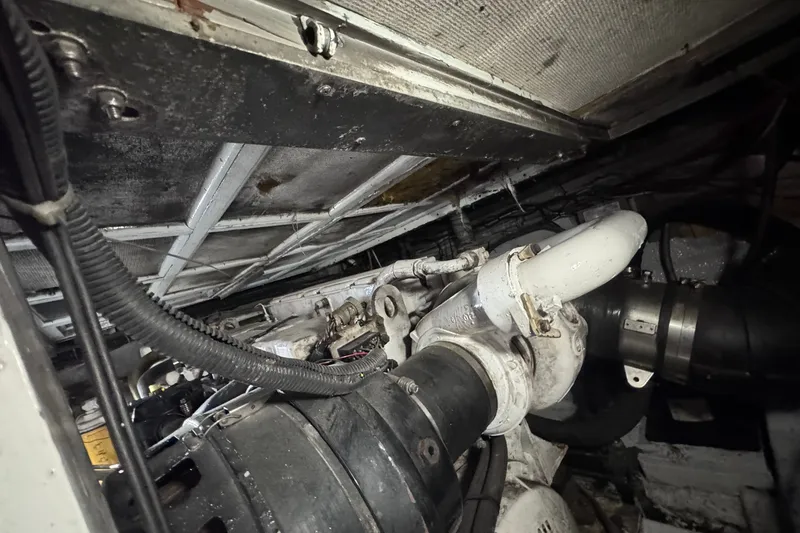 Slide: The Image of Engine room of a 1981 Hatteras 43 Convertible boat, showcasing mechanical components. - 72