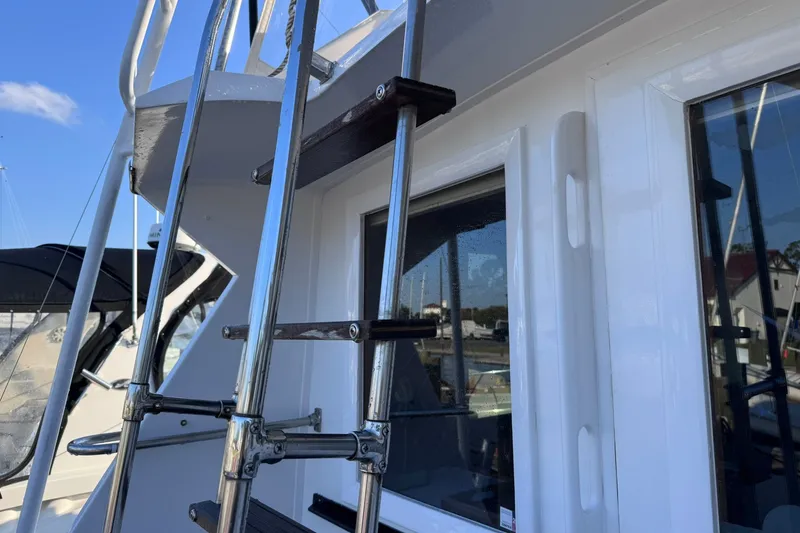 Slide: The Image of Ladder on 1981 Hatteras 43 Convertible yacht, showcasing sleek design and craftsmanship. - 17
