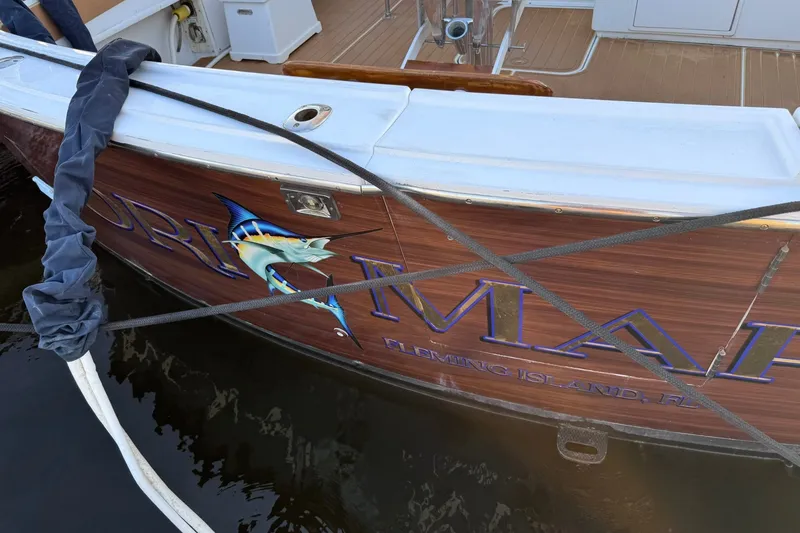 Slide: The Image of 1981 Hatteras 43 Convertible boat with marlin graphic, docked at Fleming Island, FL. - 84